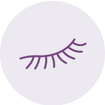 A closed eye with purple eyelashes within a light purple circle.