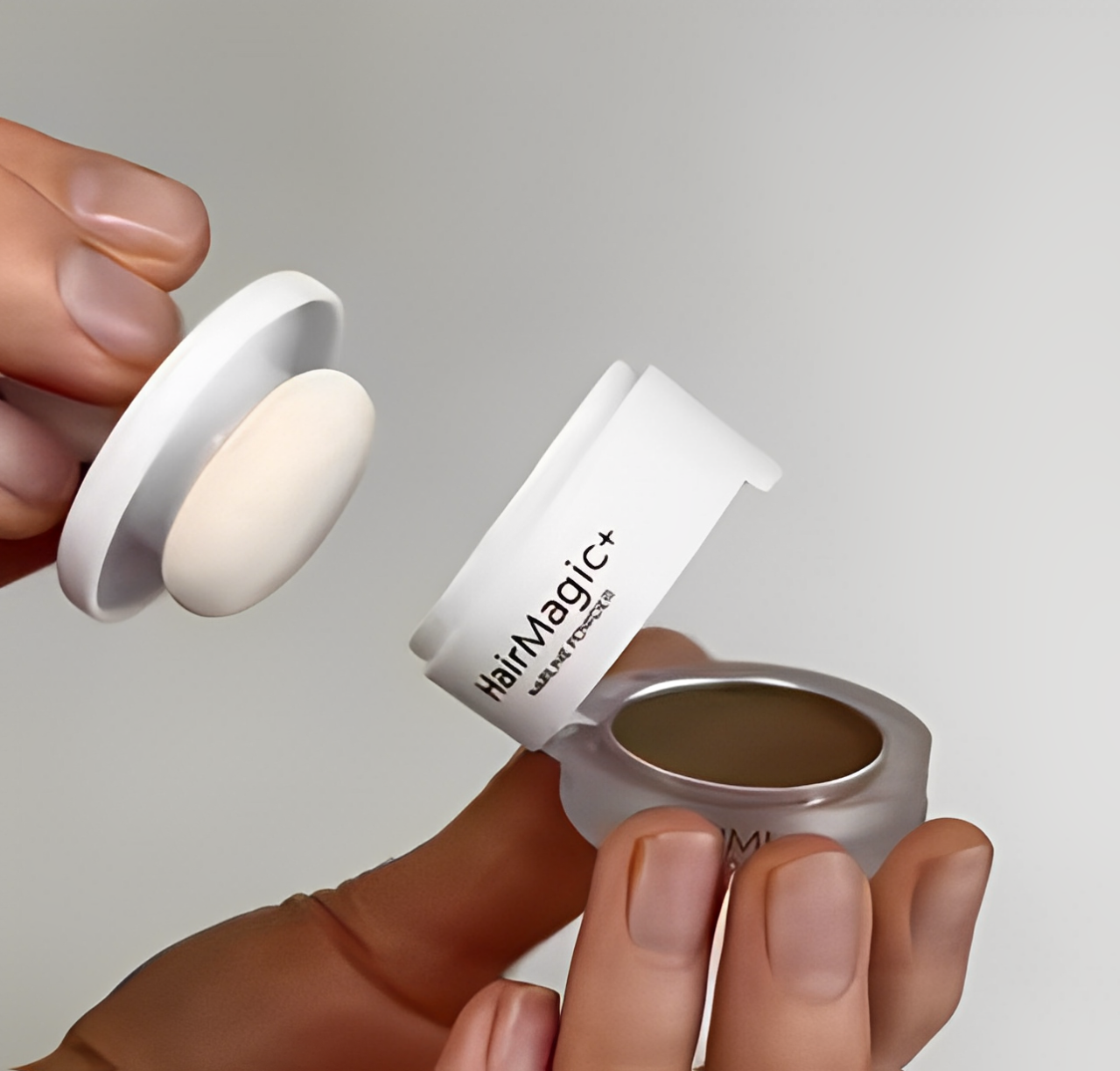 Close-up of HairMagic+ hair powder compact for thinning hair and grey coverage